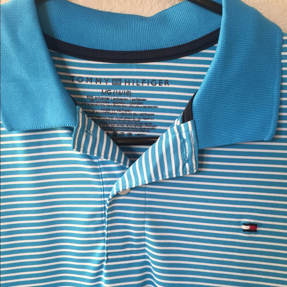 Blue and white striped golf shirt